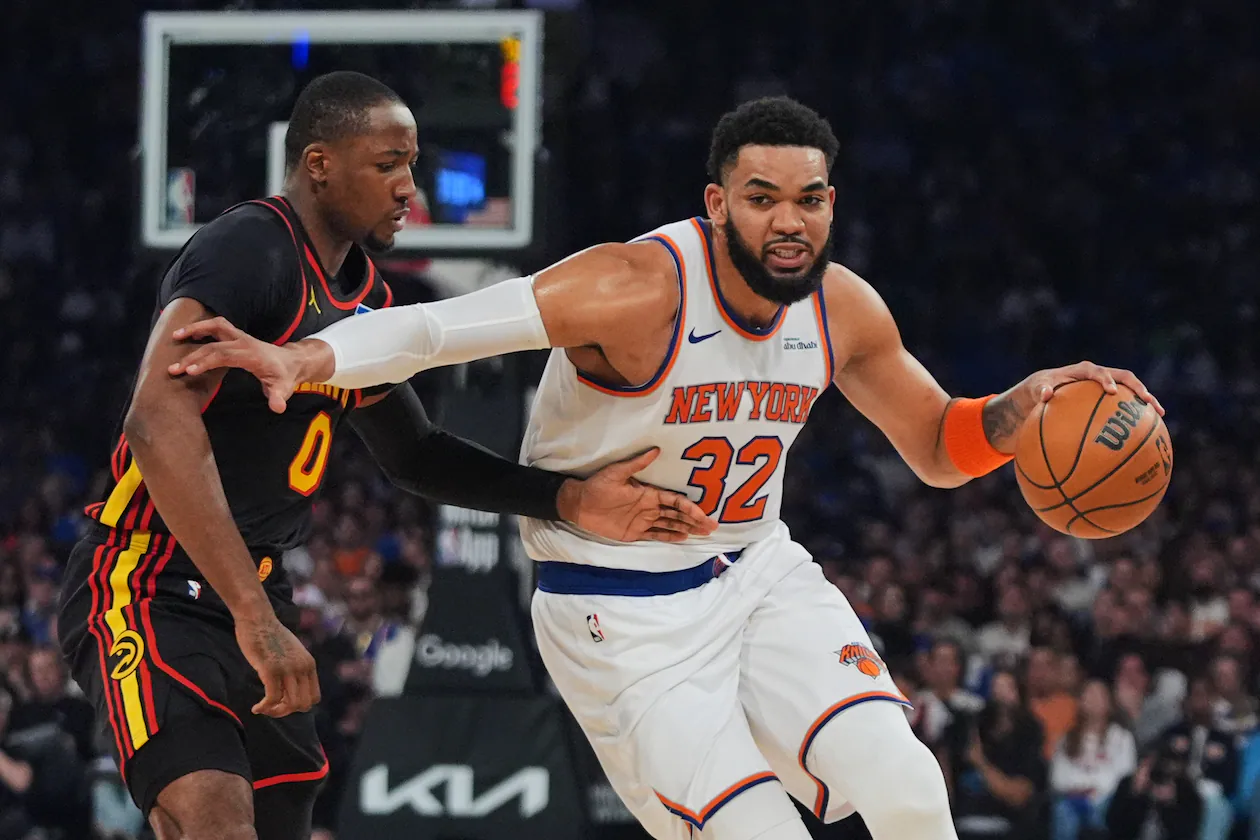 The Knicks' Karl-Anthony Towns (right) drives past the Hawks' Jonathan Kuminga during the first half in Game 1 of their first-round playoff series Saturday, April 18, 2026, in New York. (Frank Franklin II/AP)