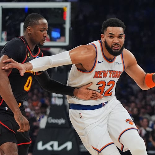 The Knicks' Karl-Anthony Towns (right) drives past the Hawks' Jonathan Kuminga during the first half in Game 1 of their first-round playoff series Saturday, April 18, 2026, in New York. (Frank Franklin II/AP)