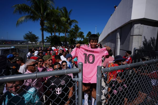 Bernardo Gasca, 10, holds an Inter Miami's Lionel Messi jersey before entering Hard Rock Stadium for the Club World Cup group A soccer match between Al Ahly and Inter Miami in Miami, Fla., Saturday, June 14, 2025. (AP Photo/Rebecca Blackwell)
