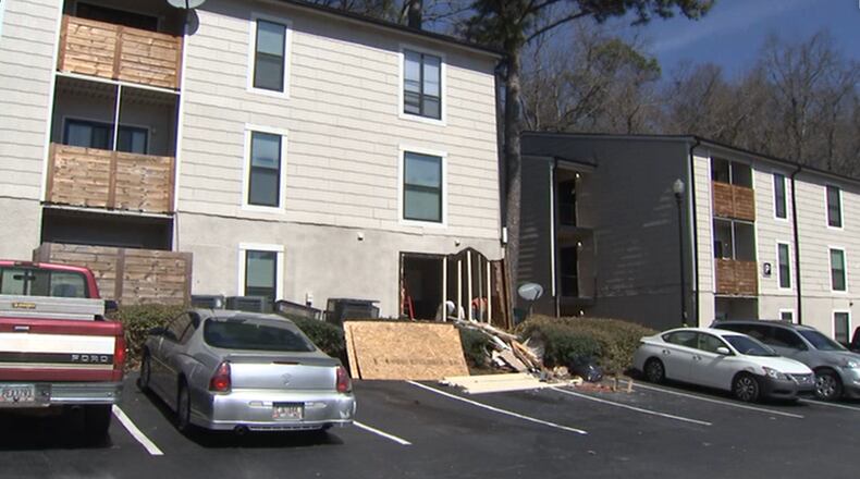 A man crashed his vehicle into a DeKalb County apartment building Sunday after he was shot while dropping off a co-worker, police said.
