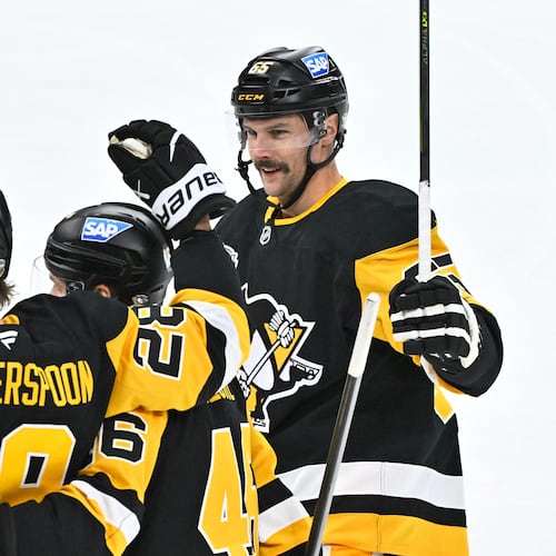 Pittsburgh's Parker Wotherspoon is congratulated by teammates Blake Lizotte and Erik Karlsson after his 1-0 goal during the NHL Global Series hockey game between the Pittsburgh Penguins and the Nashville Predators in Stockholm, Sweden, Sunday, Nov. 16, 2025. (Claudio Bresciani/TT News Agency via AP)