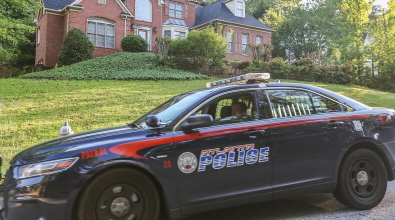 Police were investigating a home invasion Wed., May 4, 2016, in southwest Atlanta. JOHN SPINK / JSPINK@AJC.COM