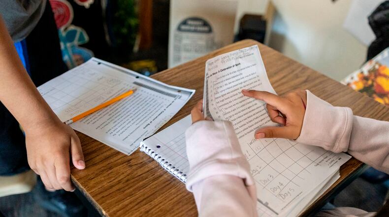 Sixth graders read a passage and give constructive feedback to their partners during Nancy Barajas' class at Fairview Elementary School on Wednesday, May 6, 2026, in Modesto, Calif. (AP Photo/Annie Barker)