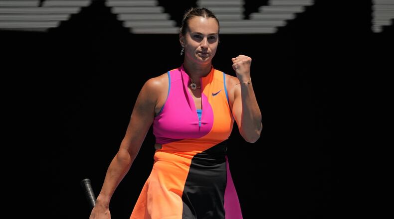 Aryna Sabalenka of Belarus reacts after defeating Victoria Mboko of Canada in their fourth round match at the Australian Open tennis championship in Melbourne, Australia, Sunday, Jan. 25, 2026. (AP Photo/Dita Alangkara)