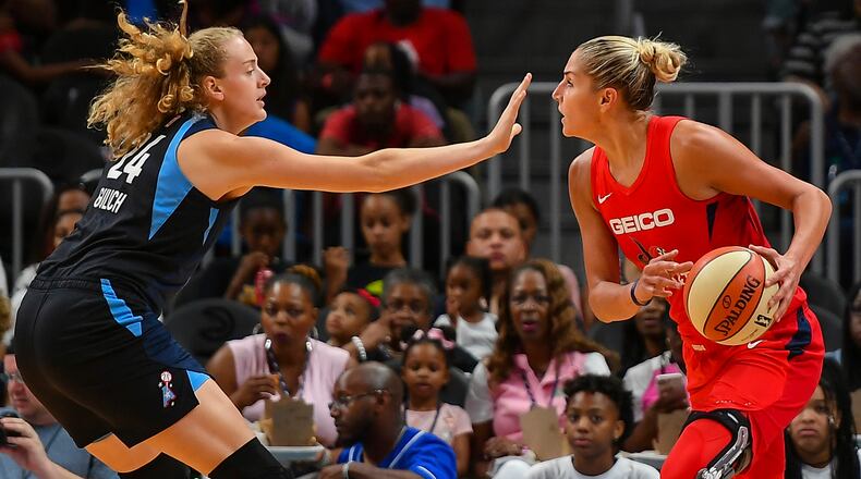 Atlanta's Marie Gulich (24) puts a hand in the face of Washington's Elena Delle Donne (11)  June 23, 2019, at State Farm Arena in Atlanta.