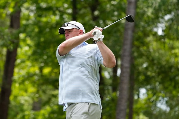 Georgia Tech football coach Brent Key watches his shot during the recent Southern Company Peach Bowl Challenge charity golf tournament. (Paul Abell for the AJC)
