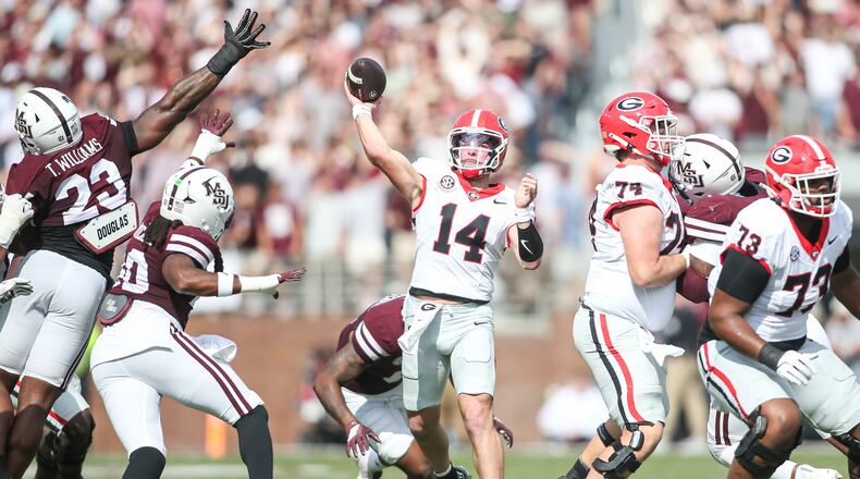 Georgia quarterback Gunner Stockton (14) throws a pass against Mississippi State during the first half of an NCAA college football game in Starkville, Miss., Saturday, Nov. 8, 2025. (AP Photo/James Pugh)
