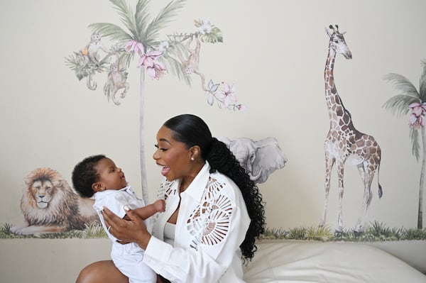 Tanika Valbrun, with her son, Jasai Kristian Valbrun, had surgeries to remove fibroids that saved her uterus. Her personal journey reinforced her commitment to The White Dress Project to help other women find alternatives to hysterectomies. (Hyosub Shin/AJC)