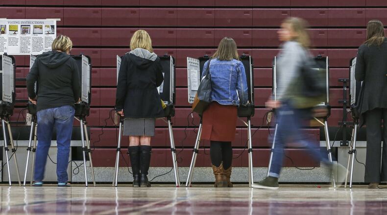 Voters waited in long lines at Henry W. Grady High School in Atlanta during the presidential election in 2016. JOHN SPINK /JSPINK@AJC.COM