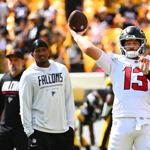 Atlanta Falcons quarterback Cooper Rush (13) warms up with Atlanta Falcons quarterback Tua Tagovailoa (1) and Atlanta Falcons quarterback Michael Penix Jr. (9) behind him before an NFL football game, Sunday, Sept. 13, 2026, in Pittsburgh. (AP Photo/Justin Berl)