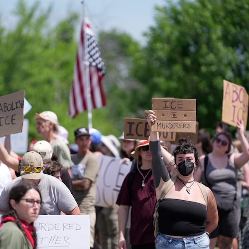 Protesters gather near the scene of a shooting involving U.S. Immigration and Customs Enforcement, Monday, July 13, 2026 in Biddeford, Maine. (AP Photo/Robert F. Bukaty)