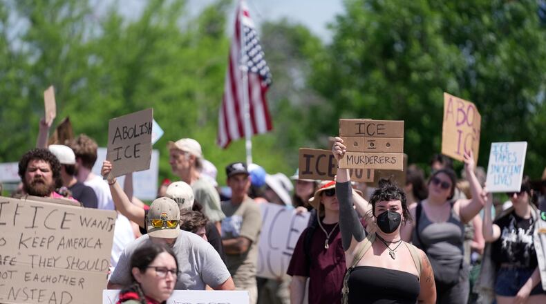 Protesters gather near the scene of a shooting involving U.S. Immigration and Customs Enforcement, Monday, July 13, 2026 in Biddeford, Maine. (AP Photo/Robert F. Bukaty)