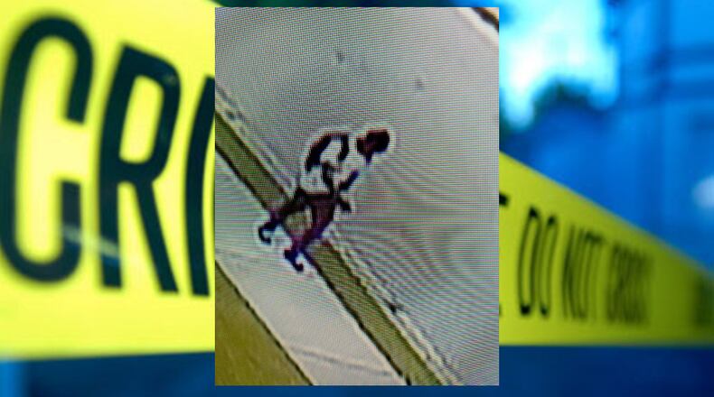 Fulton County police released grainy surveillance video of a man walking in the area around the time of Monday's deadly shooting in Union City. (Credit: Fulton County Police Department)