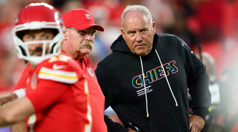 Kansas City Chiefs head coach Andy Reid, rear left, and special teams coordinator Dave Toub, right, confer during warmups before an NFL football game against the Detroit Lions, Sunday, Oct. 12, 2025 in Kansas City, Mo. (AP Photo/Reed Hoffmann, File)