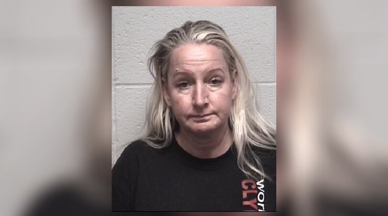 Michelle Louise Root of Gainesville was accused of abusing a dog at her pet grooming business. The dog later died. (AJC file)