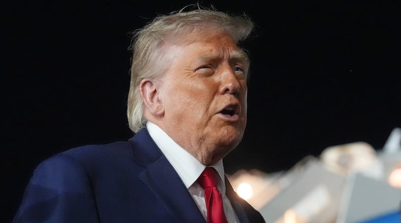 President Donald Trump talks with reporters before boarding Air Force One at John F. Kennedy International Airport in New York, early Tuesday, June 9, 2026. (AP Photo/Mark Schiefelbein)