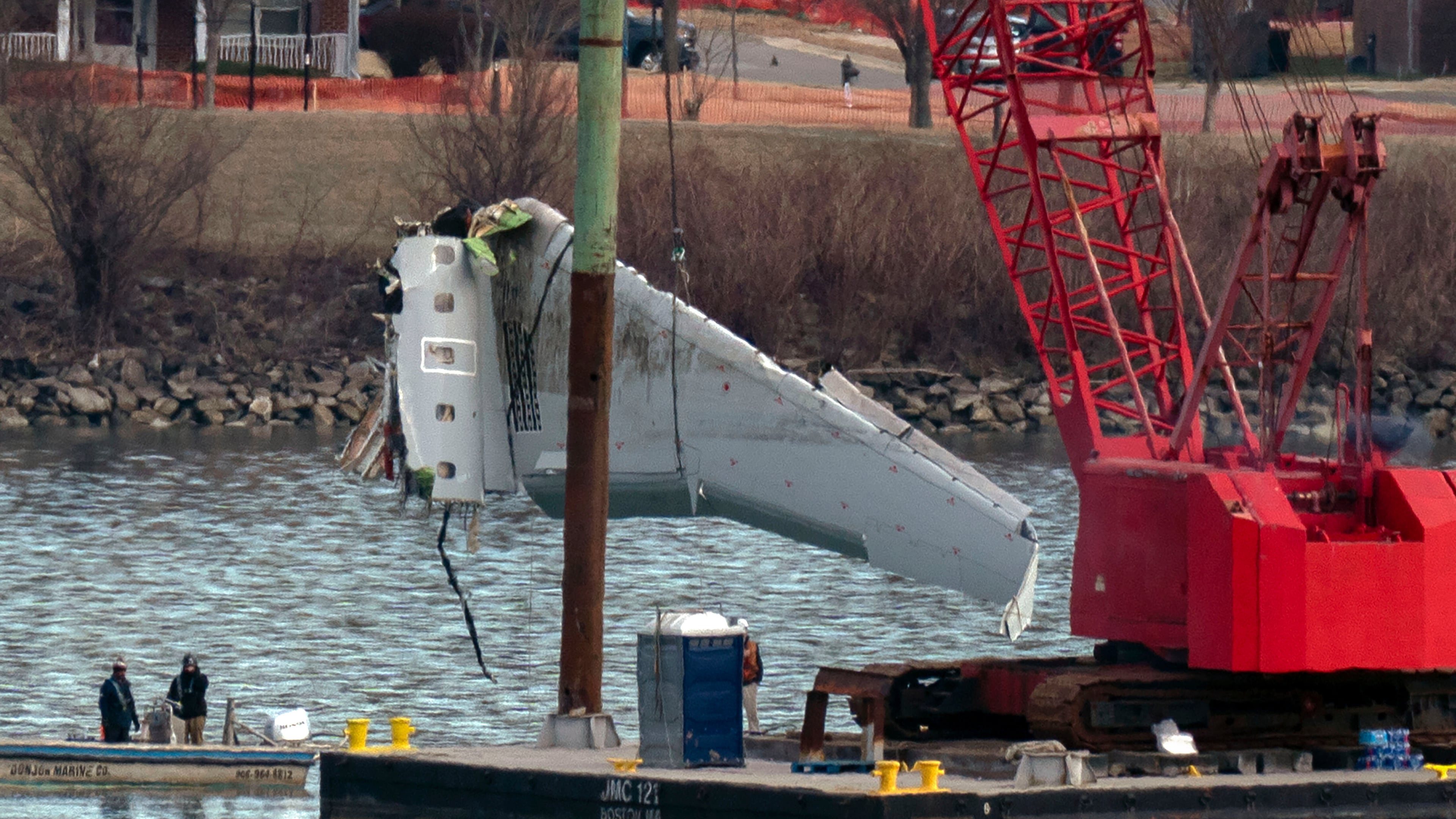 FILE - Rescue and salvage crews pull up airplane wreckage of an American Airlines jet in the Potomac River from Ronald Reagan Washington National Airport, Feb. 3, 2025, in Arlington, Va. (AP Photo/Jose Luis Magana, File)