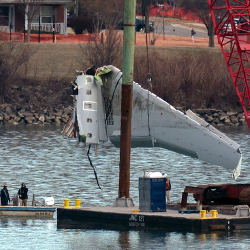 FILE - Rescue and salvage crews pull up airplane wreckage of an American Airlines jet in the Potomac River from Ronald Reagan Washington National Airport, Feb. 3, 2025, in Arlington, Va. (AP Photo/Jose Luis Magana, File)