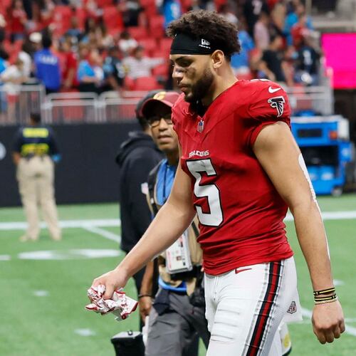 Atlanta Falcons wide receiver Drake London walks off the field with his head down after losing 34-3 to the Carolina Panthers at Mercedes-Benz Stadium in Atlanta on Sunday, Sept. 20, 2026. (Miguel Martinez/AJC)