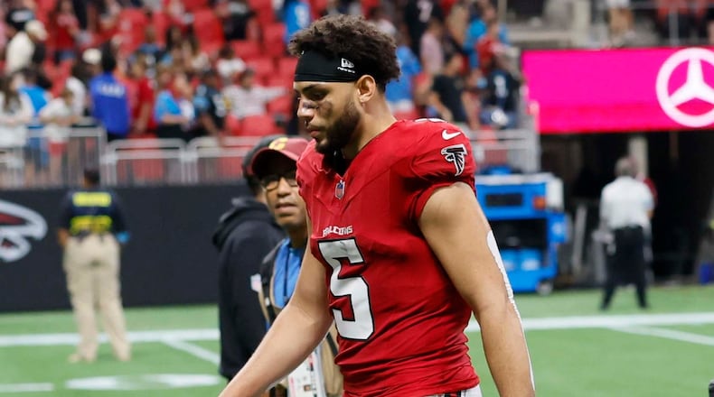 Atlanta Falcons wide receiver Drake London walks off the field with his head down after losing 34-3 to the Carolina Panthers at Mercedes-Benz Stadium in Atlanta on Sunday, Sept. 20, 2026. (Miguel Martinez/AJC)