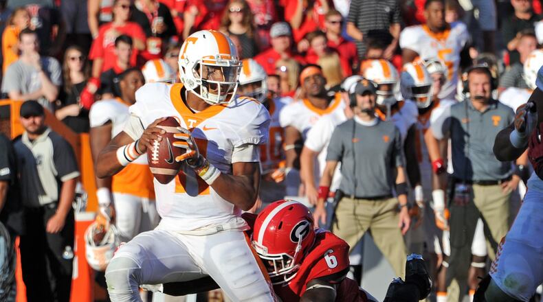 ATHENS, GA - OCTOBER 1: Joshua Dobbs #11 of the Tennessee Volunteers is sacked by Natrez Patrick #6 of the Georgia Bulldogs at Sanford Stadium on October 1, 2016 in Athens, Georgia. (Photo by Scott Cunningham/Getty Images)