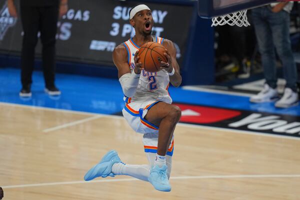 Oklahoma City Thunder guard Shai Gilgeous-Alexander (2) scores against the Indiana Pacers during the second half of Game 5 of the NBA Finals basketball series, Monday, June 16, 2025, in Oklahoma City. (AP Photo/Nate Billings)