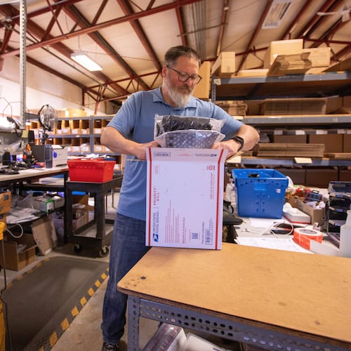FILE - Terry Precision Cycling warehouse manager Luke Tremble packs orders at the company’s warehouse in Burlington, Vt., Tuesday, Oct. 28, 2025. (AP Photo/Amanda Swinhart, File)