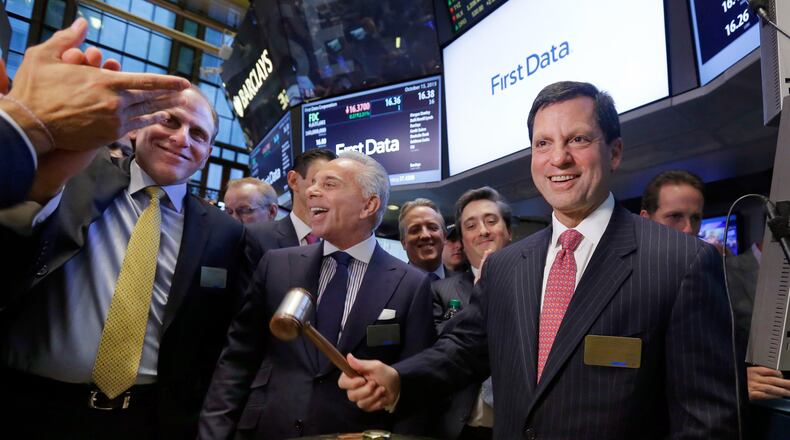 Atlanta’s First Data Corp. said it is providing free mobile payments devices to help Houston-are businesses recover from Hurricane Harvey. First Data CEO Frank Bisignano is shown ringing the bell at the company’s first day on the New York Stock Exchange in 2015. (AP Photo/Richard Drew)
