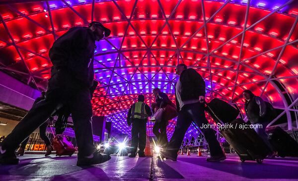The north canopy at Hartsfield-Jackson International Airport lights up to welcome visitors to Atlanta for the Super Bowl. 