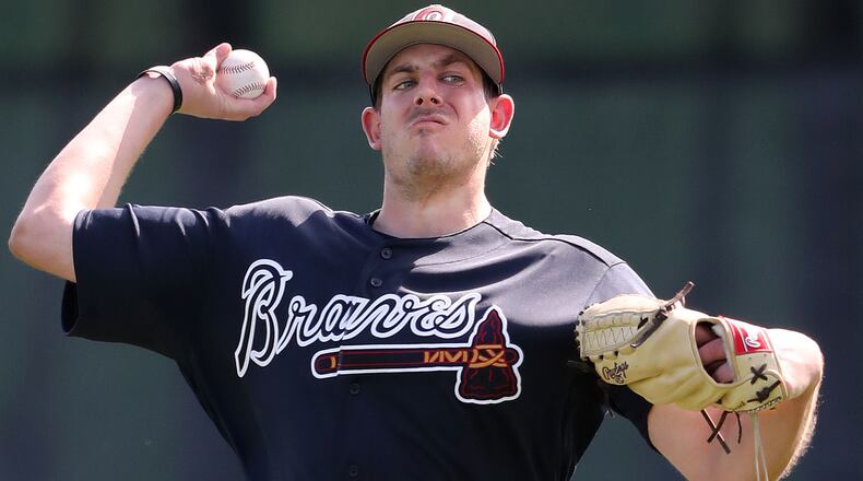 A slimmed down Braves pitcher Aaron Blair loosens up his arm during spring training on Thursday, Feb 15, 2018, at the ESPN Wide World of Sports Complex in Lake Buena Vista, Fla. Curtis Compton/ccompton@ajc.com