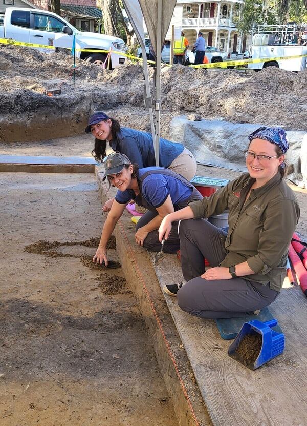 This image provided by the City of St. Augustine Archaeology Program shows City of St. Augustine Archaeology Program staff members Kate Ganas, left, Andrea White, center, and Katherine Sims excavating within the 1781 British Redoubt moat in February 2025. (City of St. Augustine Archaeology Program via AP)