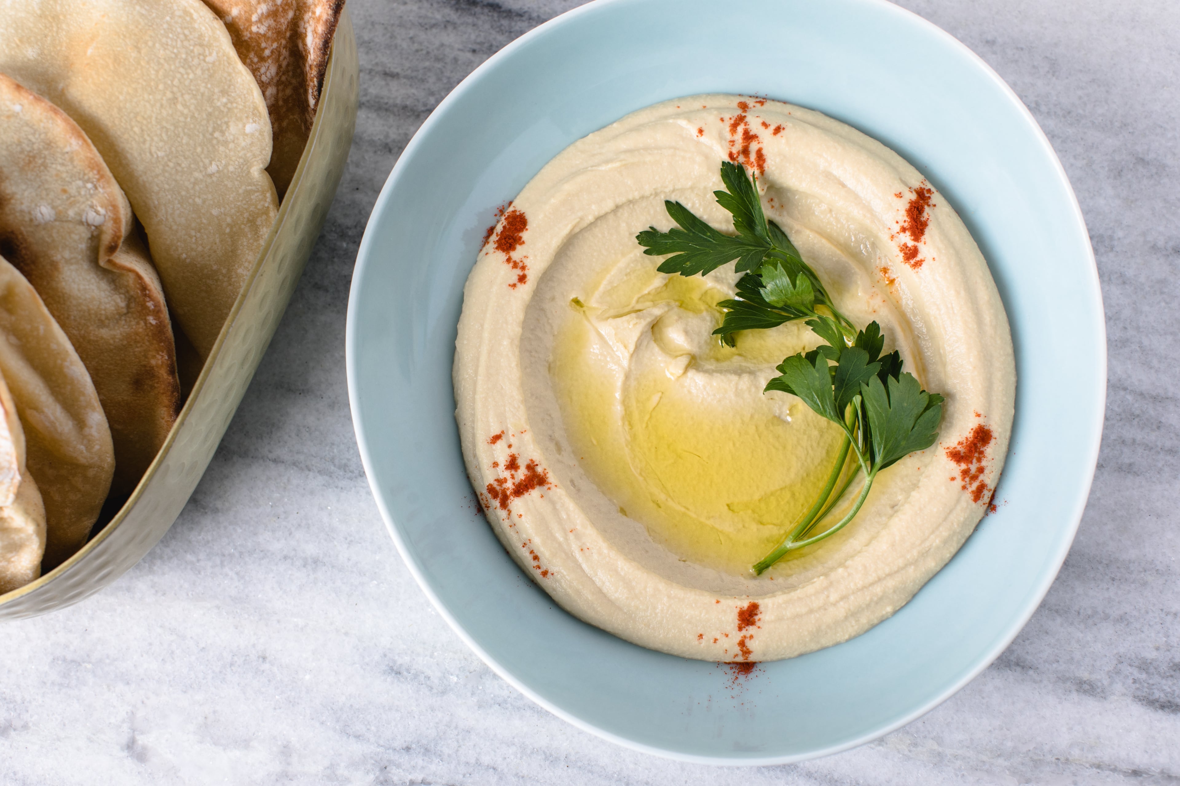 Hummus, in the Lebanese style, is creamy and mild at Zakia, made simply, with top-quality tahini and lemon juice, while eschewing garlic and other aromatics popular elsewhere. (Courtesy of Erik Meadows/Zakia)