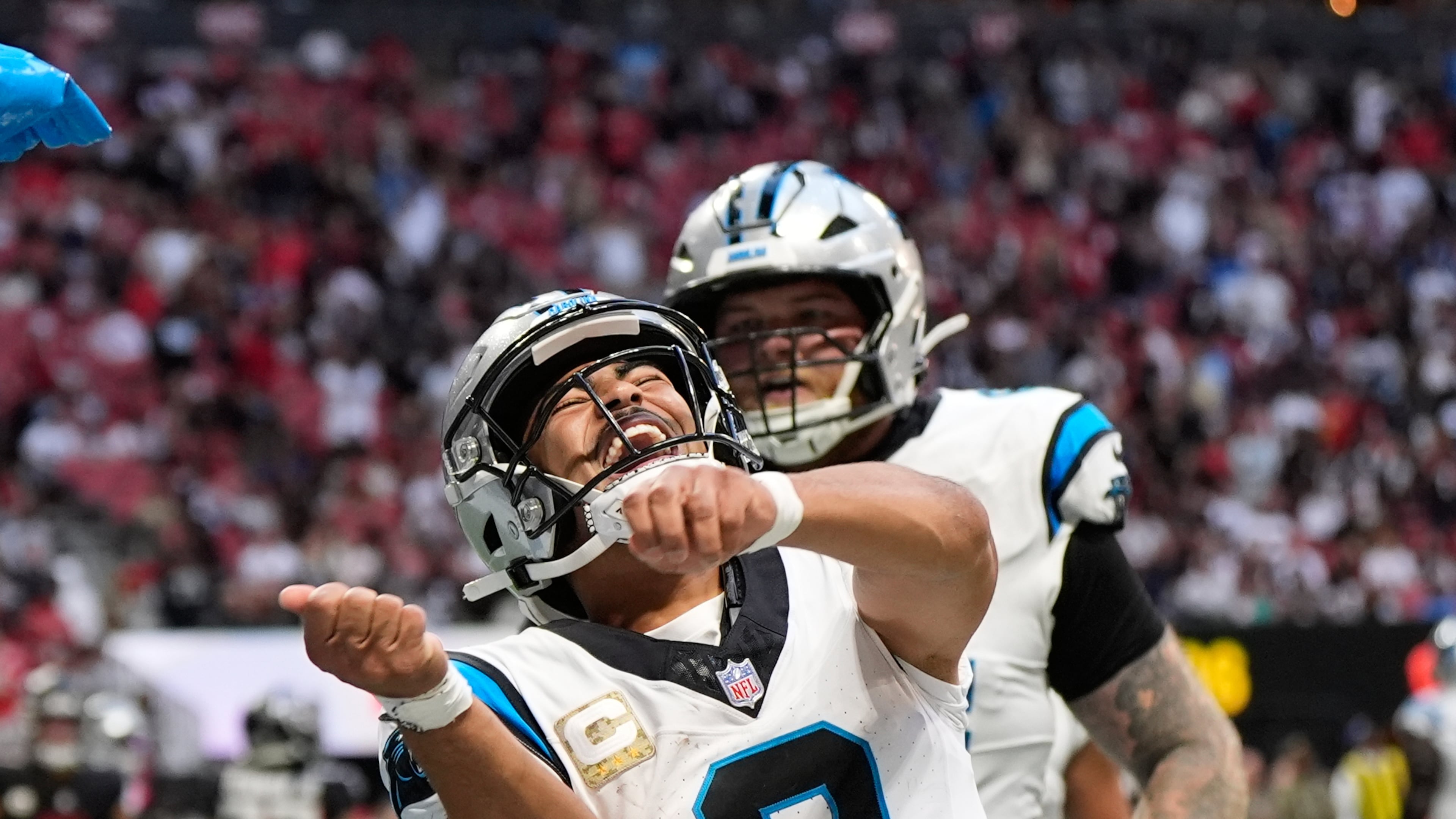 Carolina Panthers quarterback Bryce Young (9) celebrates his touchdown pass in the second half of an NFL football game against the Atlanta Falcons, Sunday, Nov. 16, 2025, in Atlanta. (AP Photo/Brynn Anderson)
