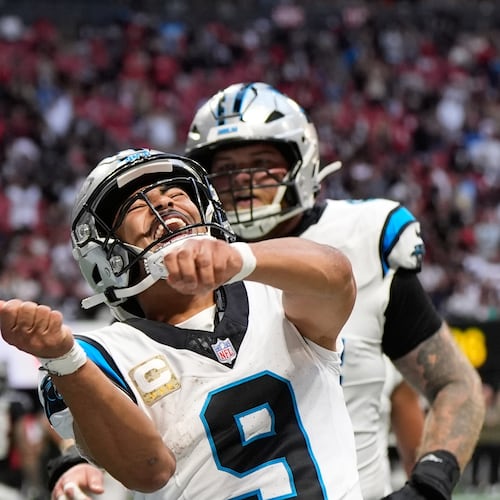 Carolina Panthers quarterback Bryce Young (9) celebrates his touchdown pass in the second half of an NFL football game against the Atlanta Falcons, Sunday, Nov. 16, 2025, in Atlanta. (AP Photo/Brynn Anderson)