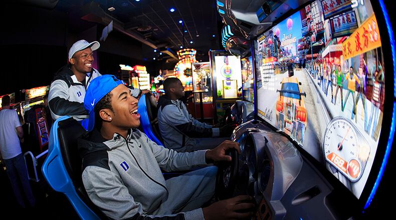 Duke players enjoyed some laughs in the Dave & Buster's game room.