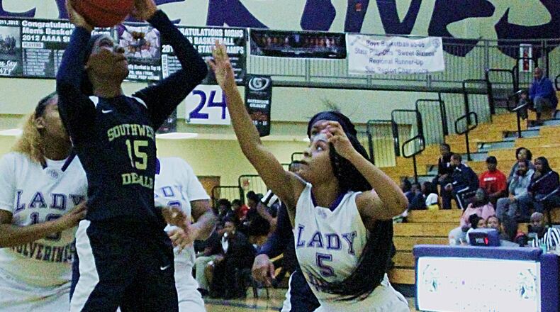 Miller Grove's Kaylen Ponder is guarded by Southwest DeKalb's Lanee Edwards. (Photo - Mark Brock)