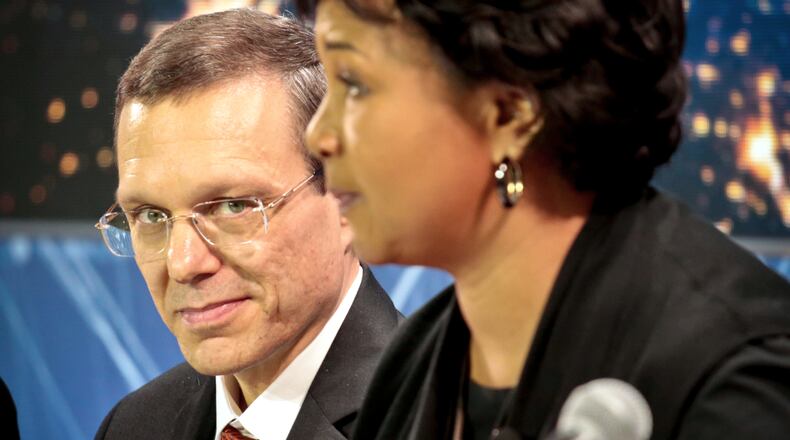 FILE - Harvard physicist Avi Loeb, left, listens as former NASA astronaut Dr. Mae C. Jemison speaks during a press conference, April 12, 2016, in New York. (AP Photo/Bebeto Matthews, File)
