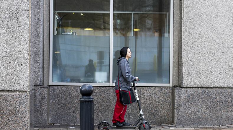 A man rides a Bird Scooter in Midtown earlier this year.