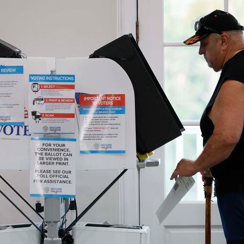 David Palyok takes his ballot at the River-Green subdivision on Tuesday, Aug. 26, 2025, in Canton. The off-year special election for the state Senate seat is to fill the remainder of former state Sen. Brandon Beach’s term, which runs through January 2027. (Miguel Martinez/AJC)