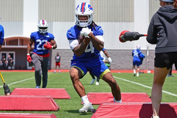 Buffalo Bills running back James Cook (4) runs a drill during practice at NFL football minicamp in Orchard Park, N.Y., Tuesday June 10, 2025. (AP Photo/Jeffrey T. Barnes)