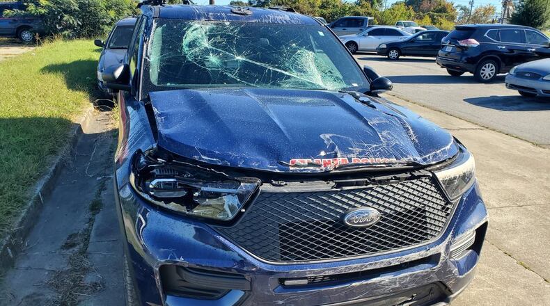 Officer Jimmy Cenescar used his patrol car as a battering ram to save a motorist who drove off a northwest Atlanta bridge early Thursday morning. ATLANTA POLICE DEPT.