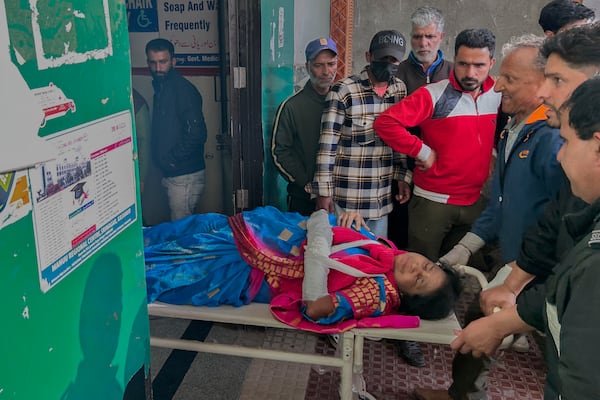 FILE - Paramedics carry a wounded tourist on a stretcher at a hospital in Anantnag after a militant attack at Pahalgam in Indian controlled Kashmir, Tuesday, April 22, 2025. (AP Photo/Dar Yasin, File)