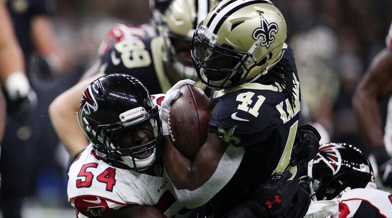 NEW ORLEANS, LA - NOVEMBER 22: Alvin Kamara #41 of the New Orleans Saints runs with the ball as Foye Oluokun #54 of the Atlanta Falcons defends at the Mercedes-Benz Superdome on November 22, 2018 in New Orleans, Louisiana. (Photo by Chris Graythen/Getty Images)