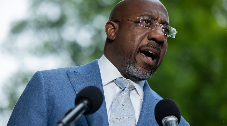 U.S. Sen. Raphael Warnock speaks at a news conference on the Voting Right’s Act, across the street from the U.S. Supreme Court, in Washington, April 2026. (Nathan Posner for the AJC)