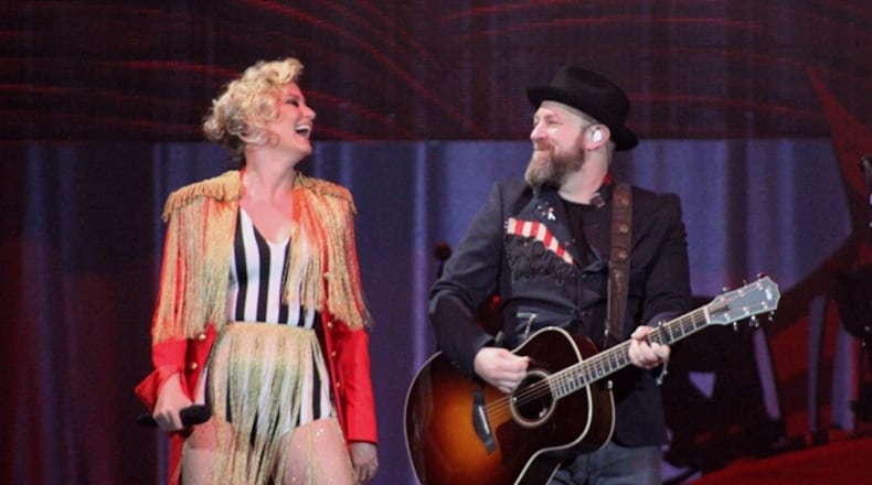 Jennifer Nettles and Kristian Bush share a smile as Sugarland takes the stage for the first date of their first tour in five years on May 25, 2018 in Augusta. Photo: Melissa Ruggieri/AJC