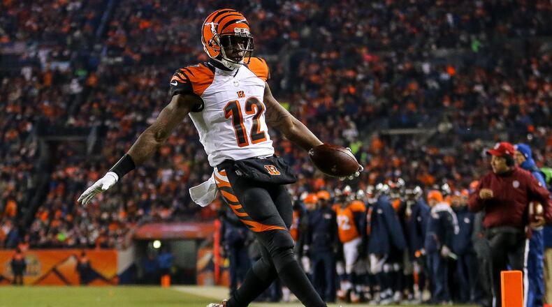 DENVER, CO - DECEMBER 28: Wide receiver Mohamed Sanu #12 of the Cincinnati Bengals rushes for a touchdown after taking a direct snap at the 6-yard line in the second quarter of a game against the Denver Broncos at Sports Authority Field at Mile High on December 28, 2015 in Denver, Colorado. (Photo by Justin Edmonds/Getty Images)