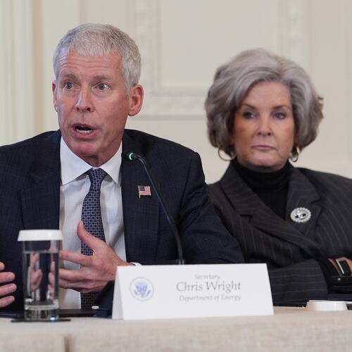 Energy Secretary Chris Wright speaks as White House chief of staff Susie Wiles listens during a meeting with President Donald Trump and oil executives in the East Room of the White House, Friday, Jan. 9, 2026, in Washington. (AP Photo/Evan Vucci)