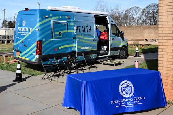 A mobile health unit is parked outside of Independence High School in Charlotte, N.C., on Wednesday, March 19, 2025. (AP Photo/Matt Kelley)