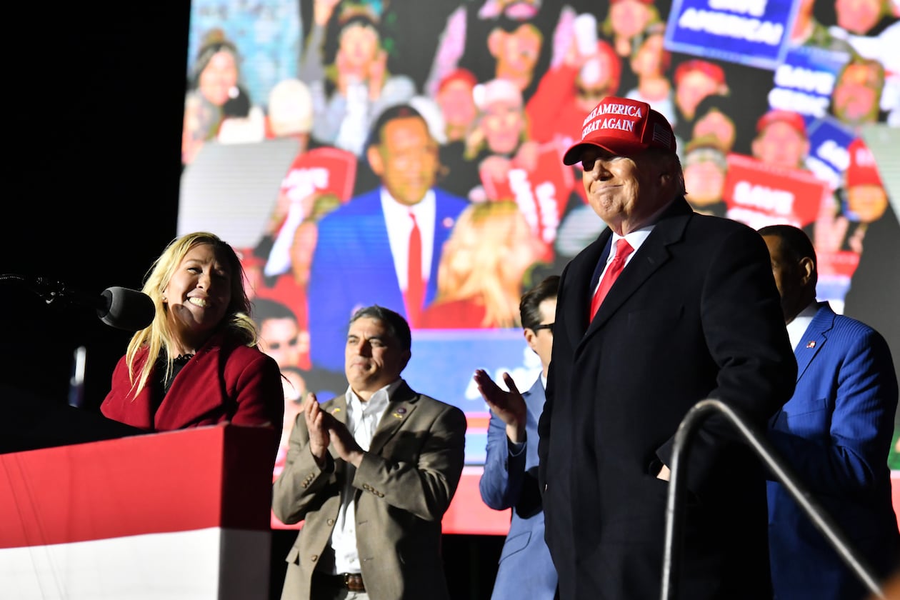 U.S. Rep. Marjorie Taylor Greene thanks former President Donald Trump during a rally for Georgia GOP candidates at the Banks County Dragway in Commerce in March 2022. Greene will headline a rally from Trump on Tuesday in New York City to coincide with his appearance in a Manhattan courtroom in connection with his indictment. (Hyosub Shin / Hyosub.Shin@ajc.com)