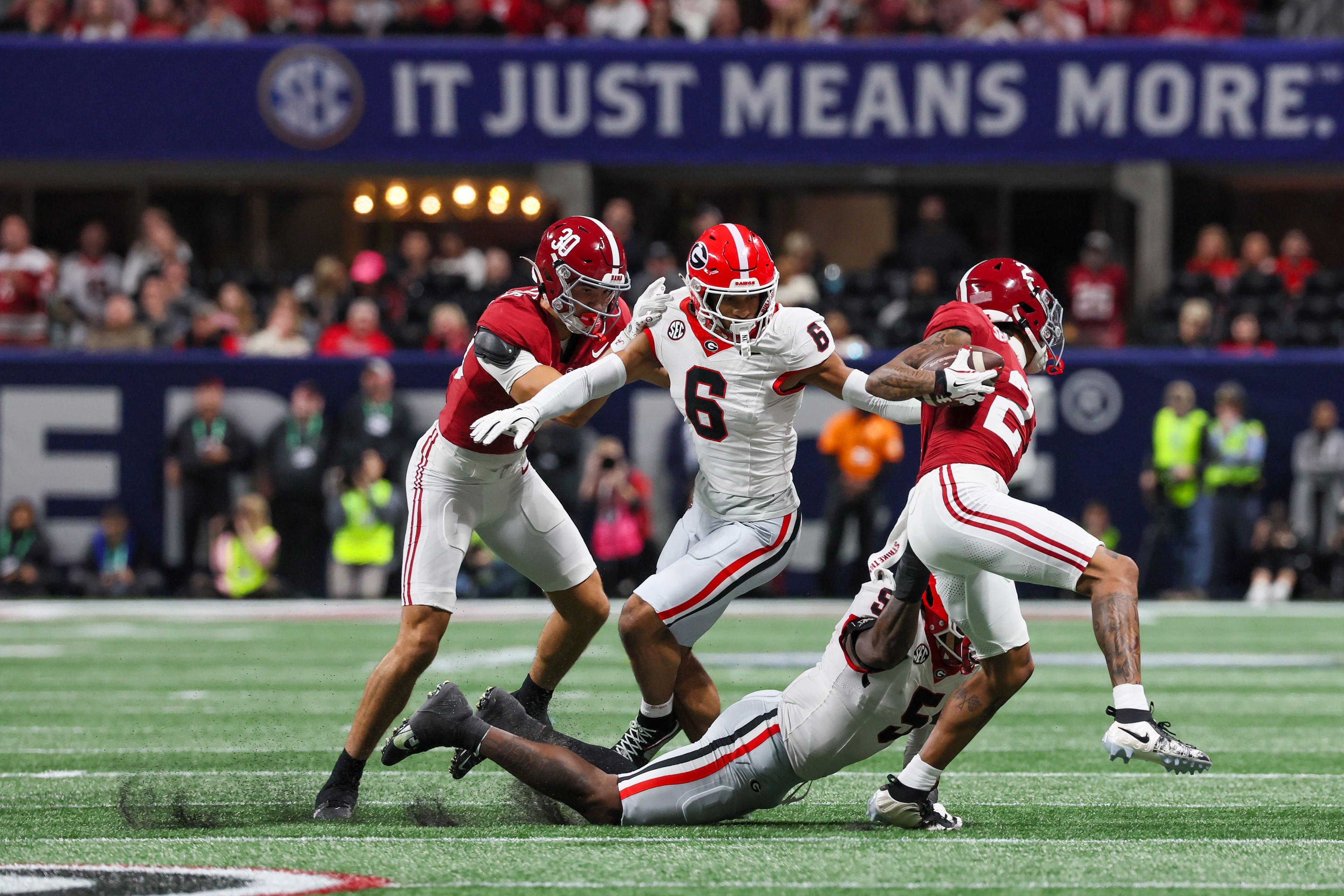 Alabama wide receiver Ryan Williams (2) gains yardage against the Georgia defense during the second quarter of the SEC Championship game at Mercedes-Benz Stadium, Saturday, Dec. 6, 2025, in Atlanta. (Jason Getz / AJC)